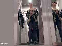 Jeny in the fitting room wearing blue seamless pantyhose trying on a various clothes